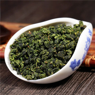 Tie Guan Yin dry tea leaves close-up - jade green dragonfly head pearls from Anxi
